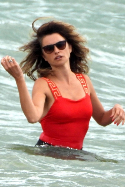 penelope-cruz-seen-wearing-a-red-top-and-black-shorts-while-enjoying-a-day-out-on-the-beach-in-fregene-italy-200721_2.jpg